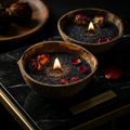 Black Sand signature candle hand-poured into a real coconut shell with matte black wax
