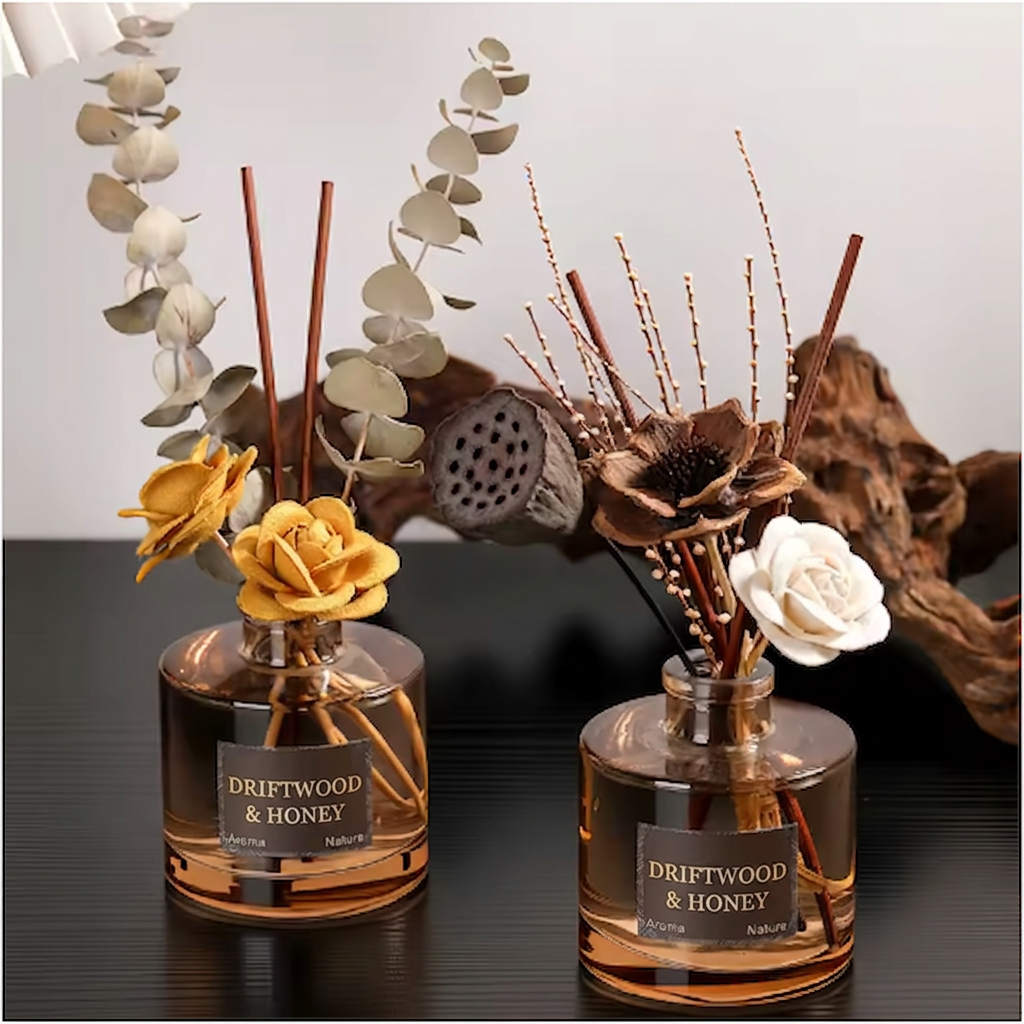 The Coastal Ritual aromatherapy reed diffuser duo with natural rattan reeds, styled side by side